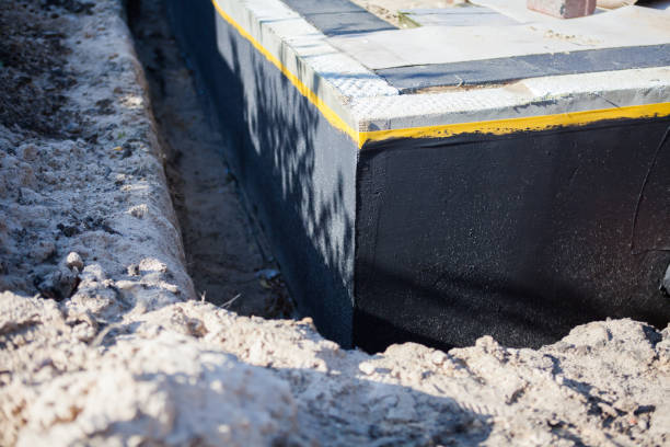 Professional Basement Waterproofing technician working in Pulteney, NY